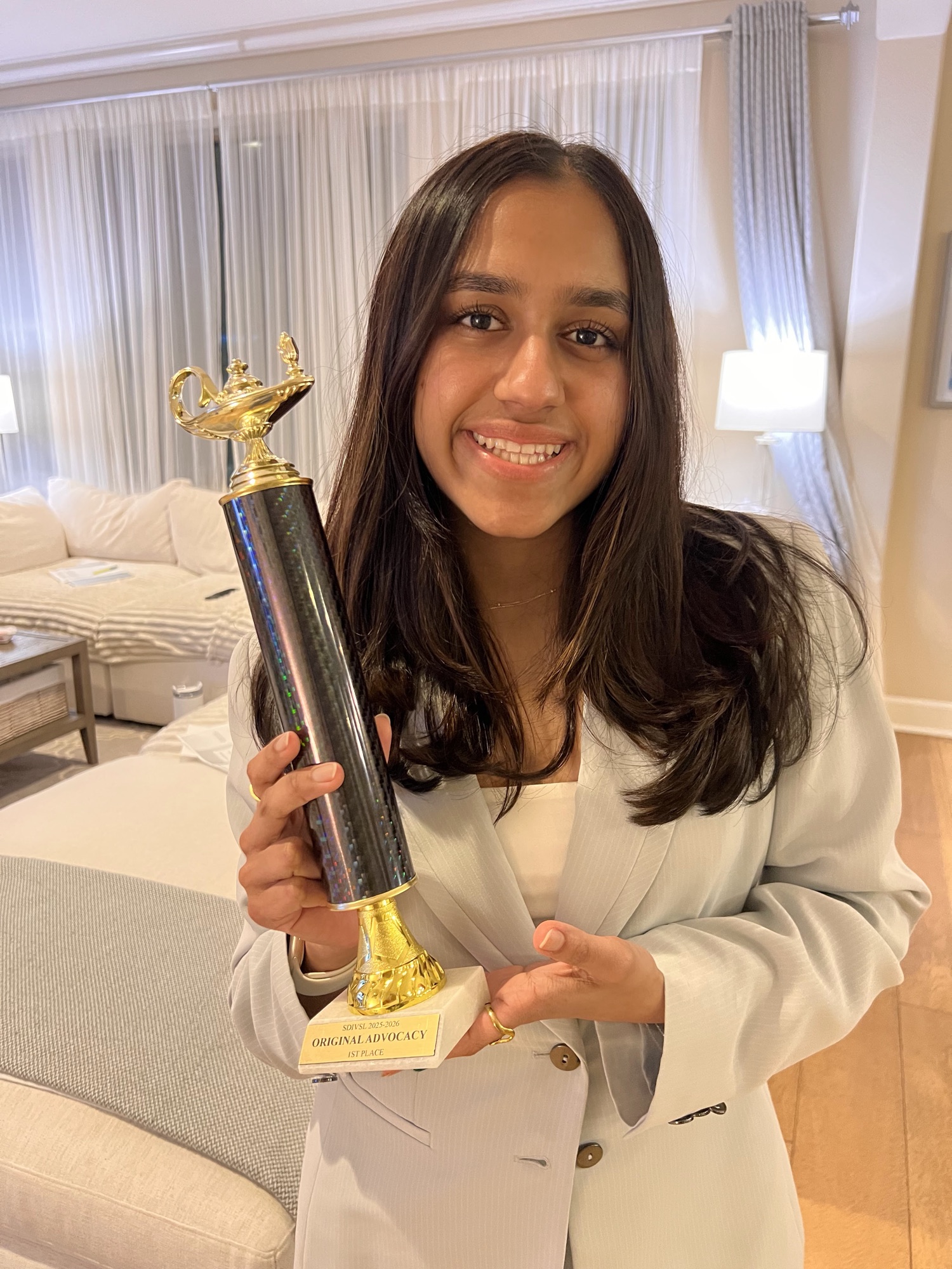 Maya with an Original Advocacy 1st place trophy